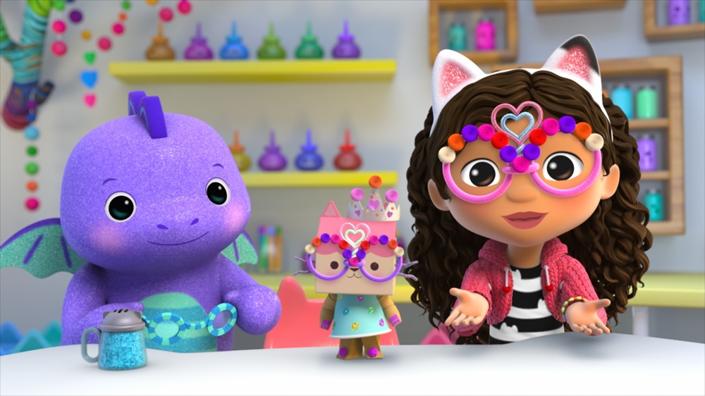 Gabby's Dollhouse S12. (L to R) River Jose as Baby Dragon, Maggie Lowe as Baby Box Cat and Laila Lockhart Kraner as Gabby Girl. [c/o Netflix © 2025]