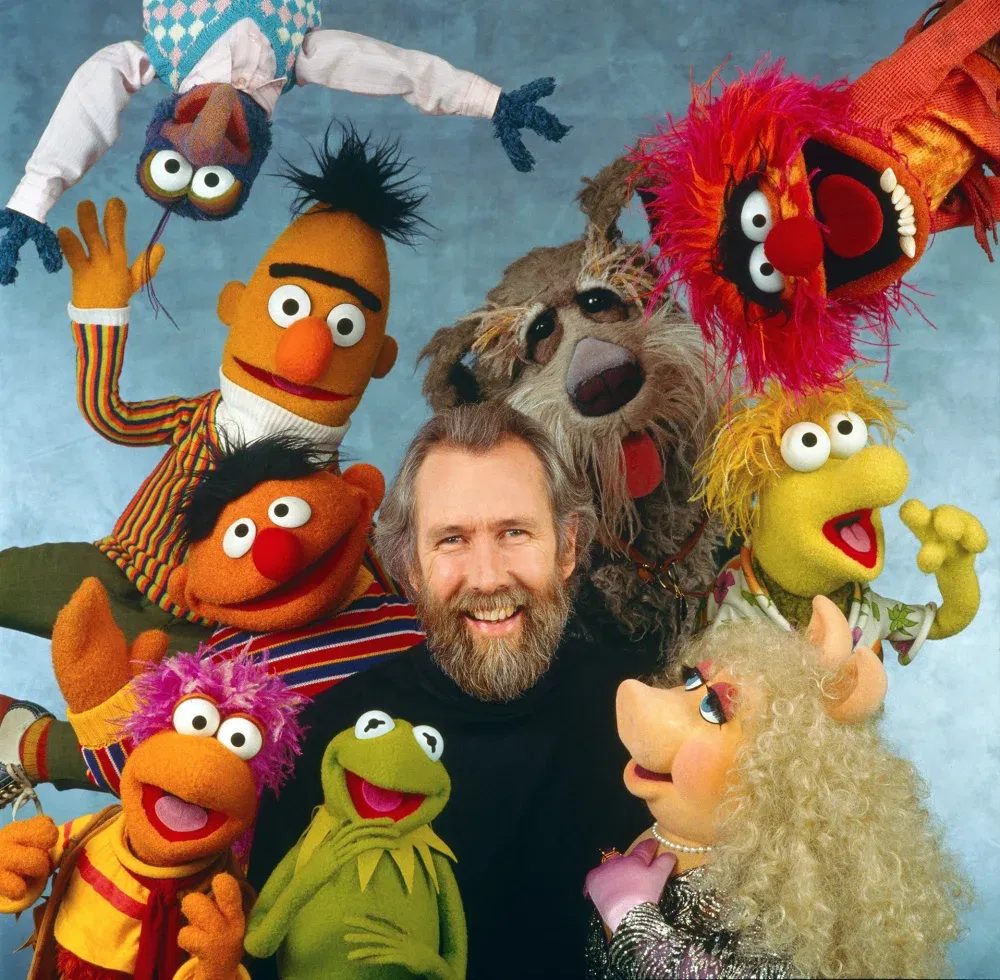 Jim Henson with Sesame Street, Muppets and Fraggle Rock characters.