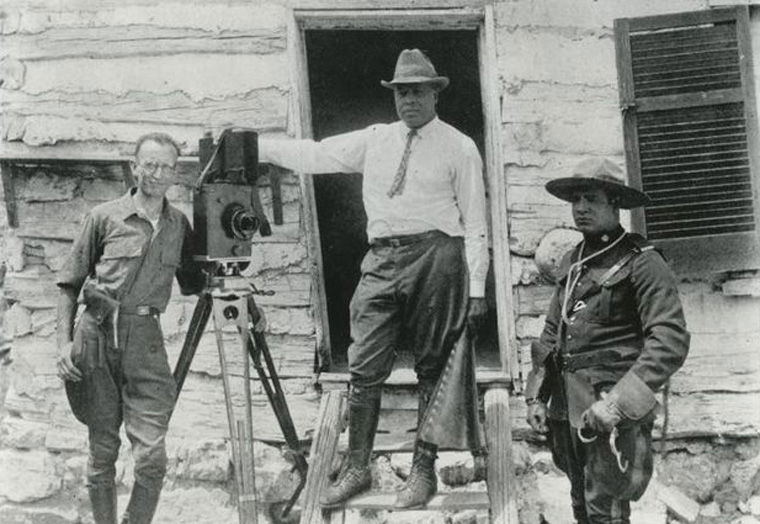 Pioneering African-American director and studio founder Oscar Micheaux (center) on set. [Photo: New York Public Library, Schomburg Center for Research in Black Culture]