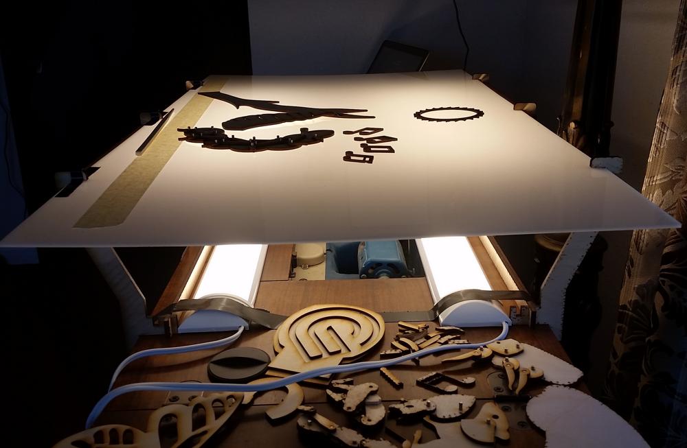 The light table was illuminated by two (not too expensive) kitchen under-cabinet lights from the hardware store. 